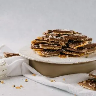 salted toffee matzah on a cake stand