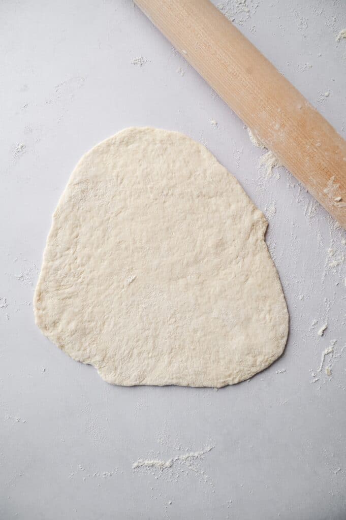 rolling out flatbread dough