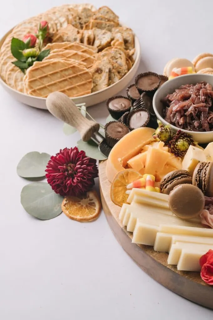 fall decorations around a cheeseboard