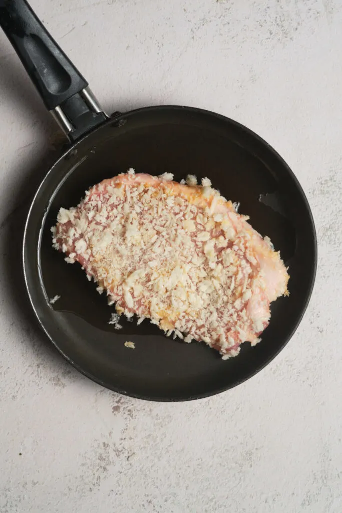 Parmesan crusted pork chop - in the pan