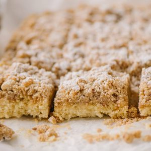 slices of new york crumb cake on a piece of parchment paper